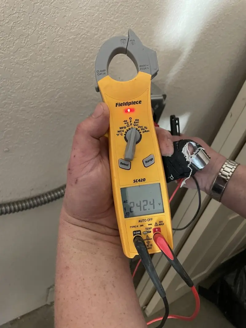Voltage testing with clamp meter during Generator Installation in New Carlisle